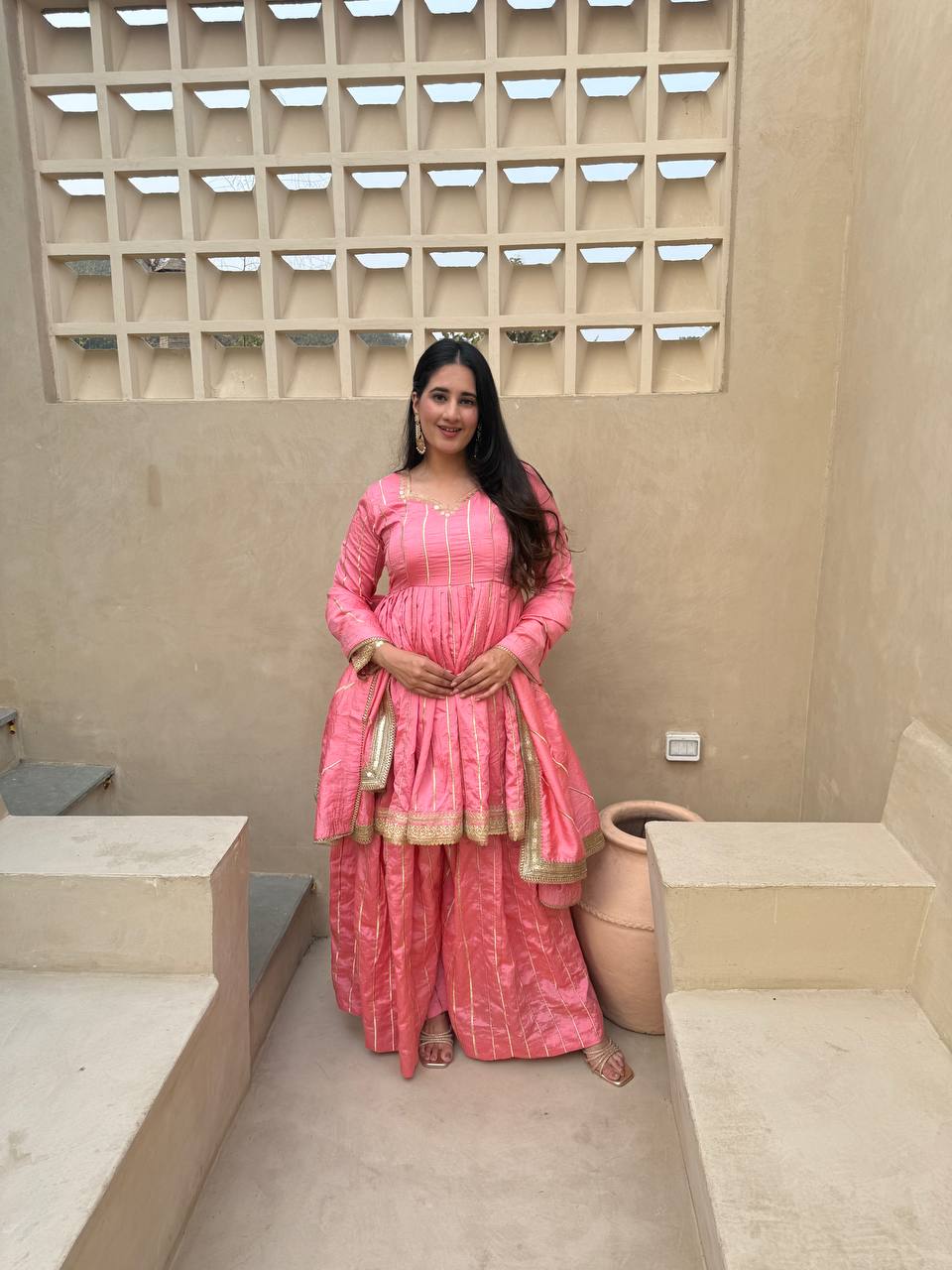 Radiant Rose Pink Flared Peplum Kurti and Sharara Set Embellished with Luminous Gold Zari Stripes and Sequined Borders